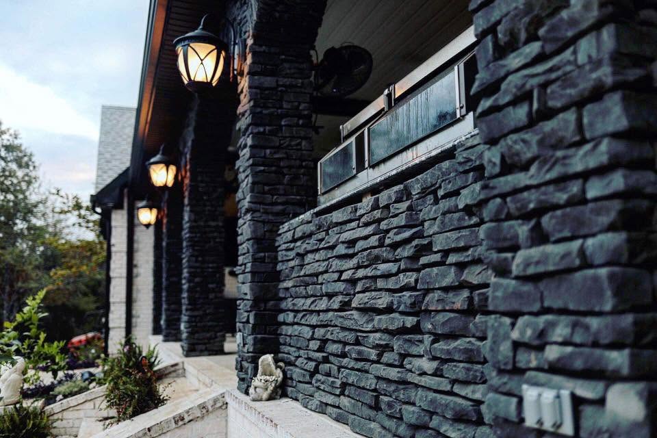 Dark stacked stone porch & columns